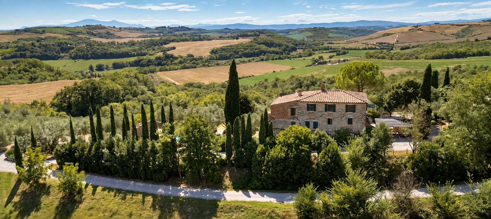 poggio-il-poderuccio-veduta-aerea-casale-colline-01